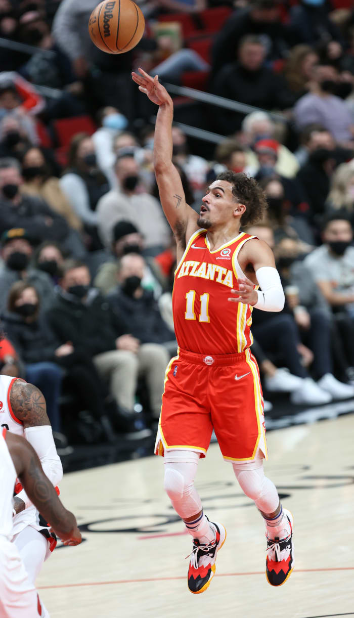 Jan 3, 2022; Portland, Oregon, USA; Atlanta Hawks guard Trae Young (11) shoots a floater against the Portland Trail Blazers in the first half at Moda Center.